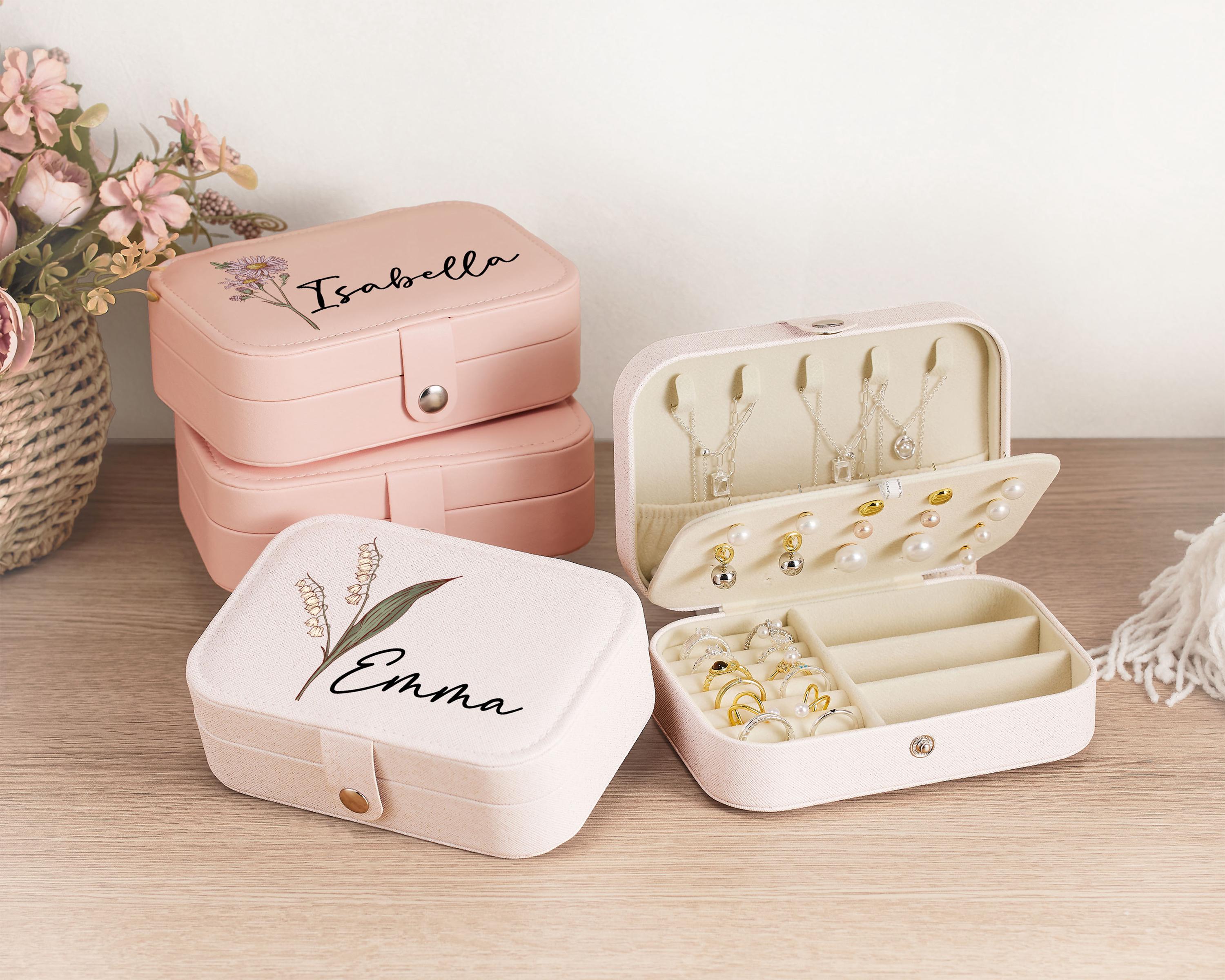 a couple of pink boxes sitting on top of a table