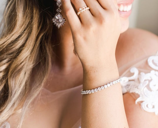 The Wedding Tennis Bracelet displayed from different angles, showcasing its exquisite design and dazzling diamonds.