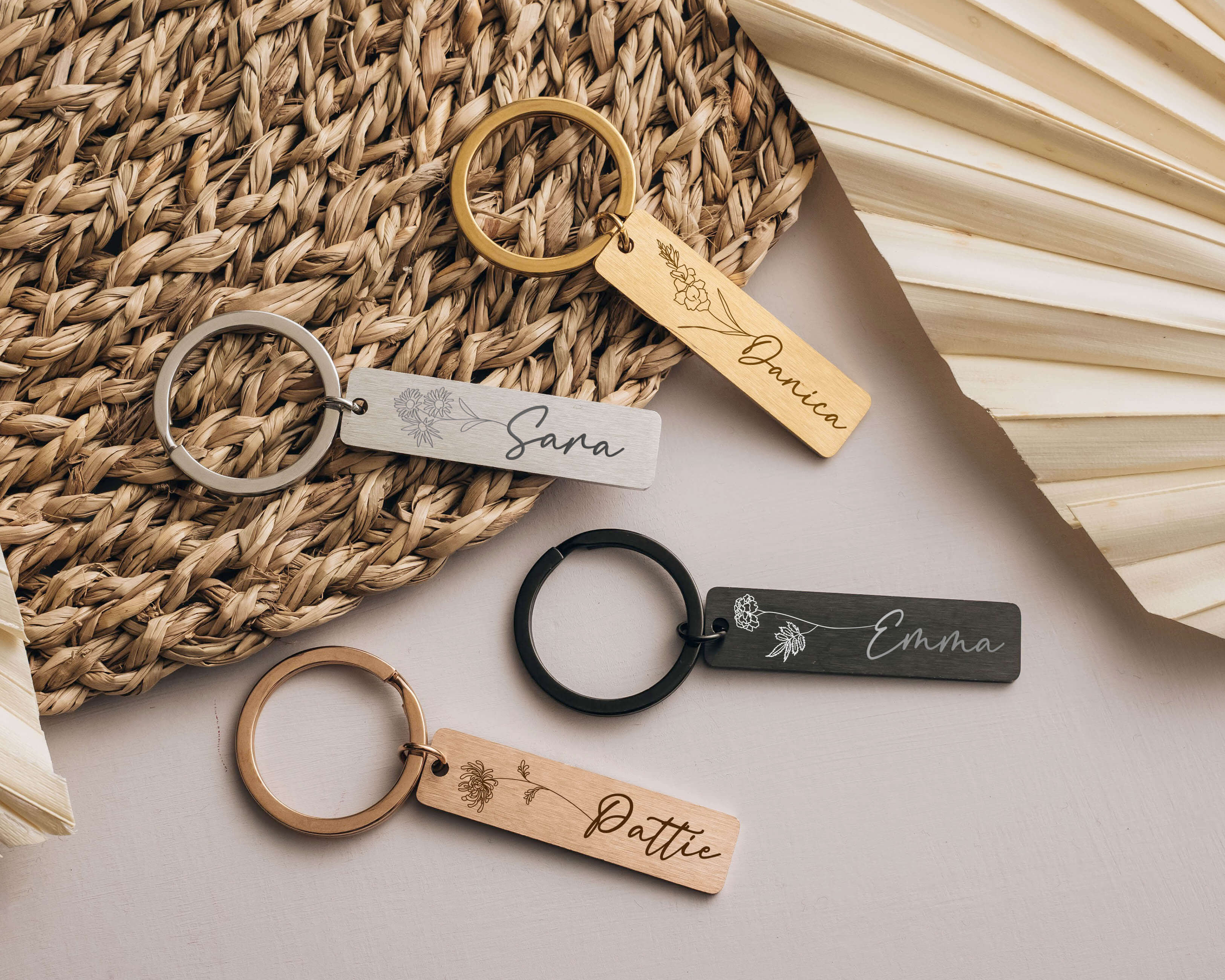 Rosegold, Gold, Black and Silver Personalized Keychains with birth flower image and name.