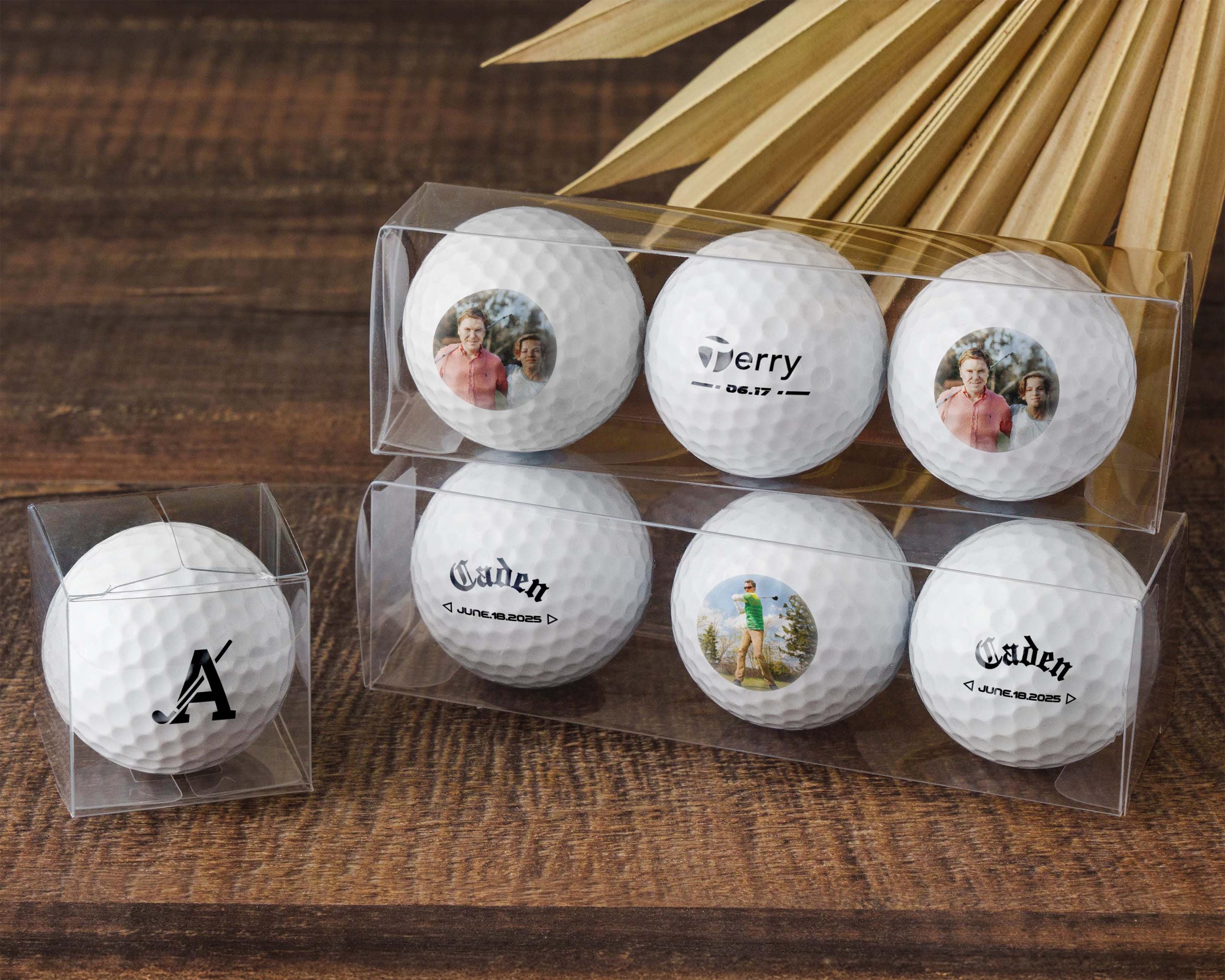 six golf balls in a clear display case