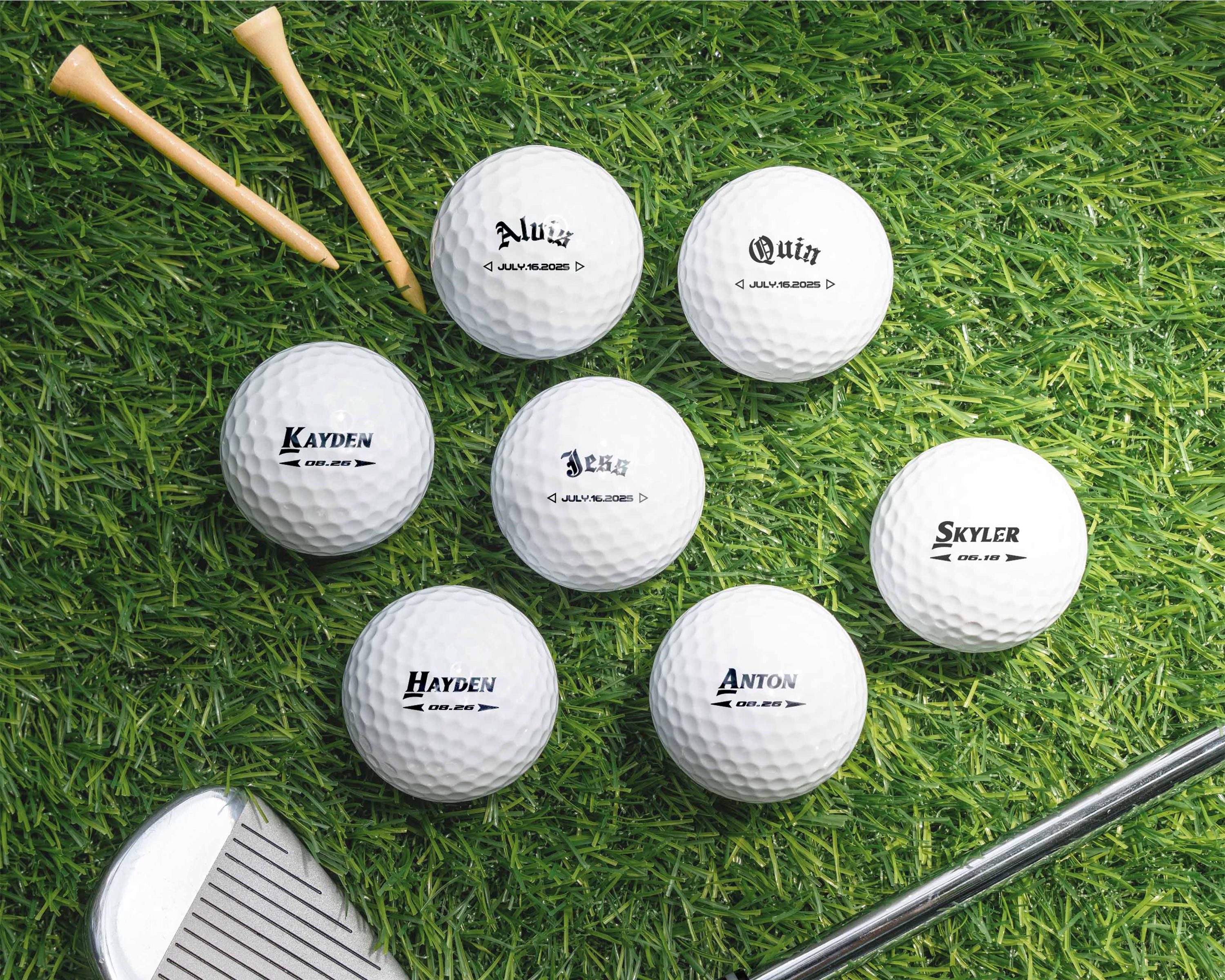 a group of golf balls and a club on the grass