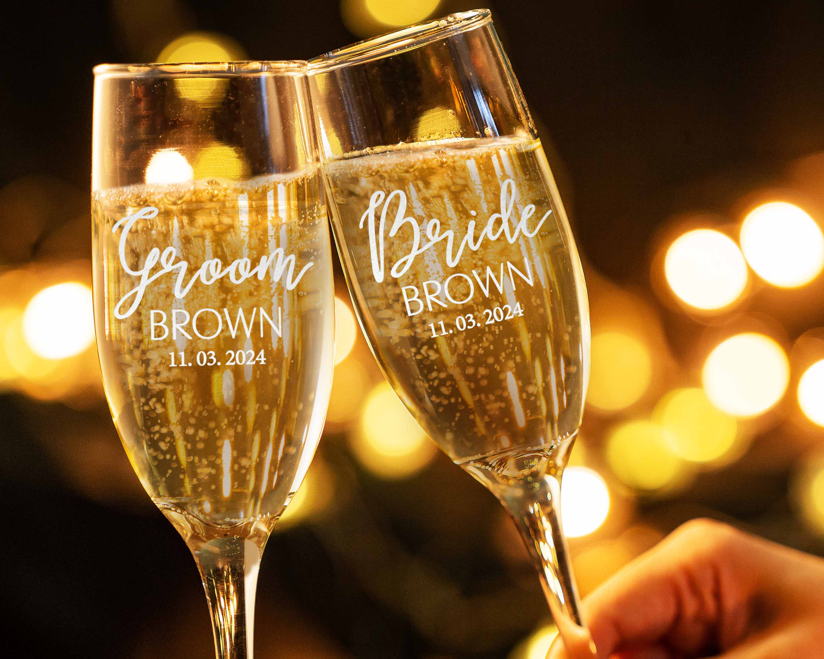 The bride and groomsmen hold our Custom Wedding Toasting Flutes with name. The perfect couple wine glasses for wedding day.