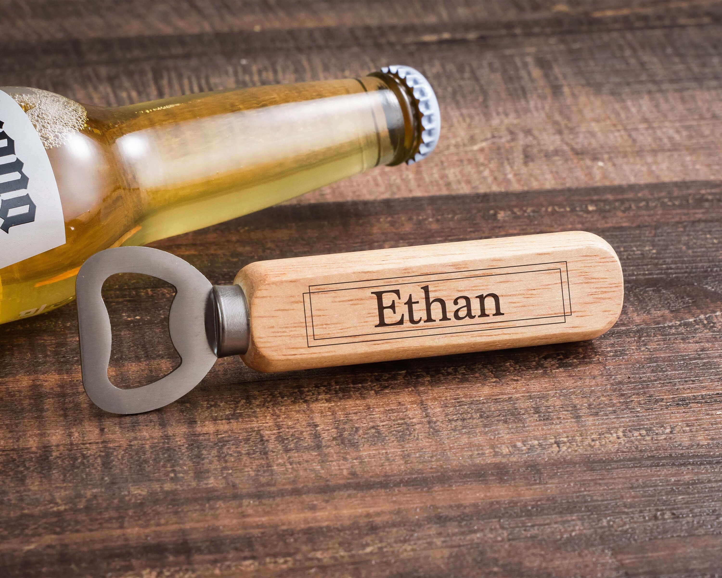 a bottle opener sitting next to a bottle of beer