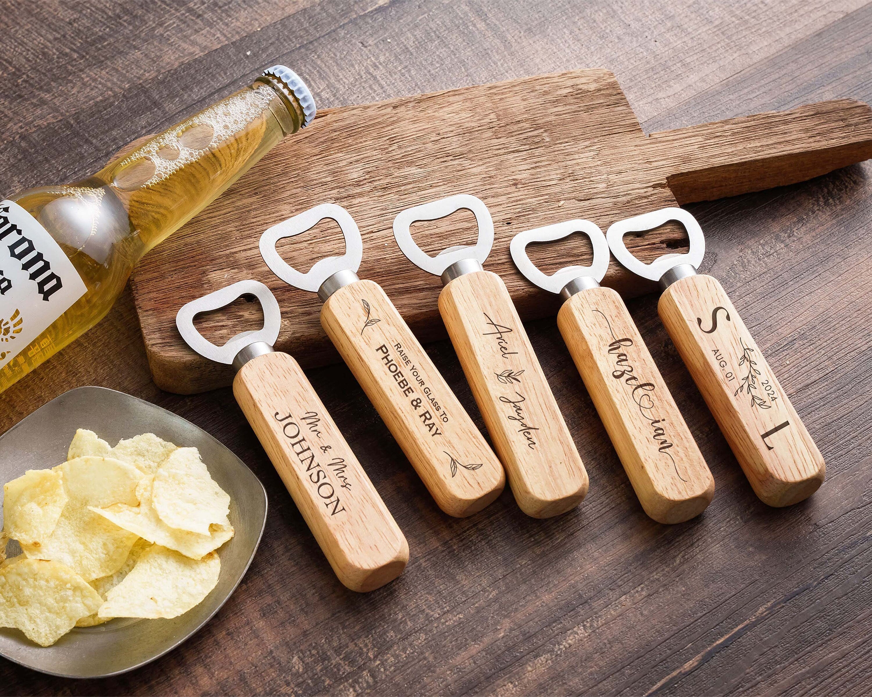 four bottle openers are sitting next to a plate of chips