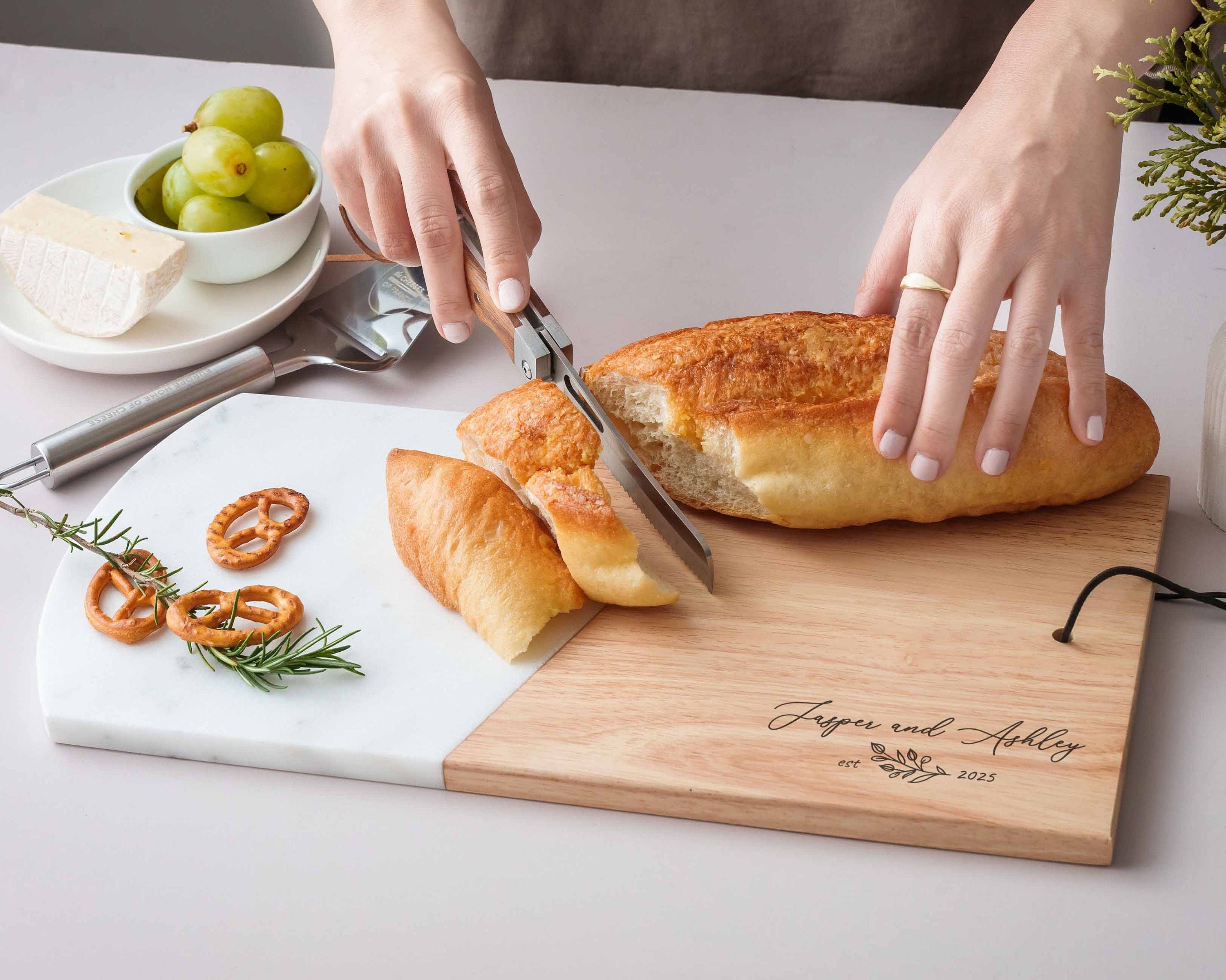 a person cutting a loaf of bread on a cutting board