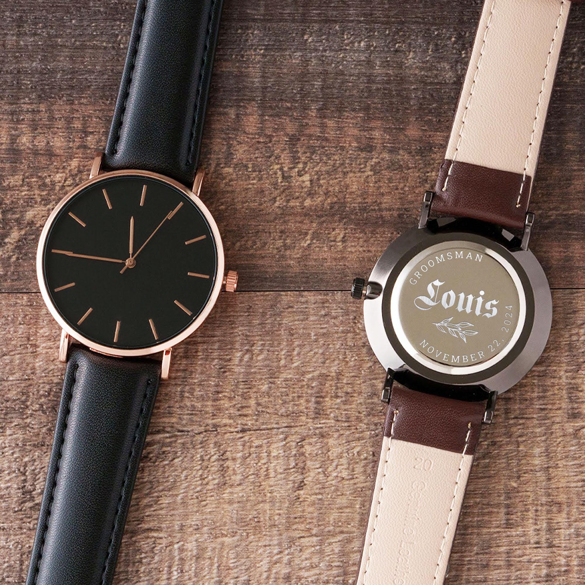 a wooden watch sitting next to a book