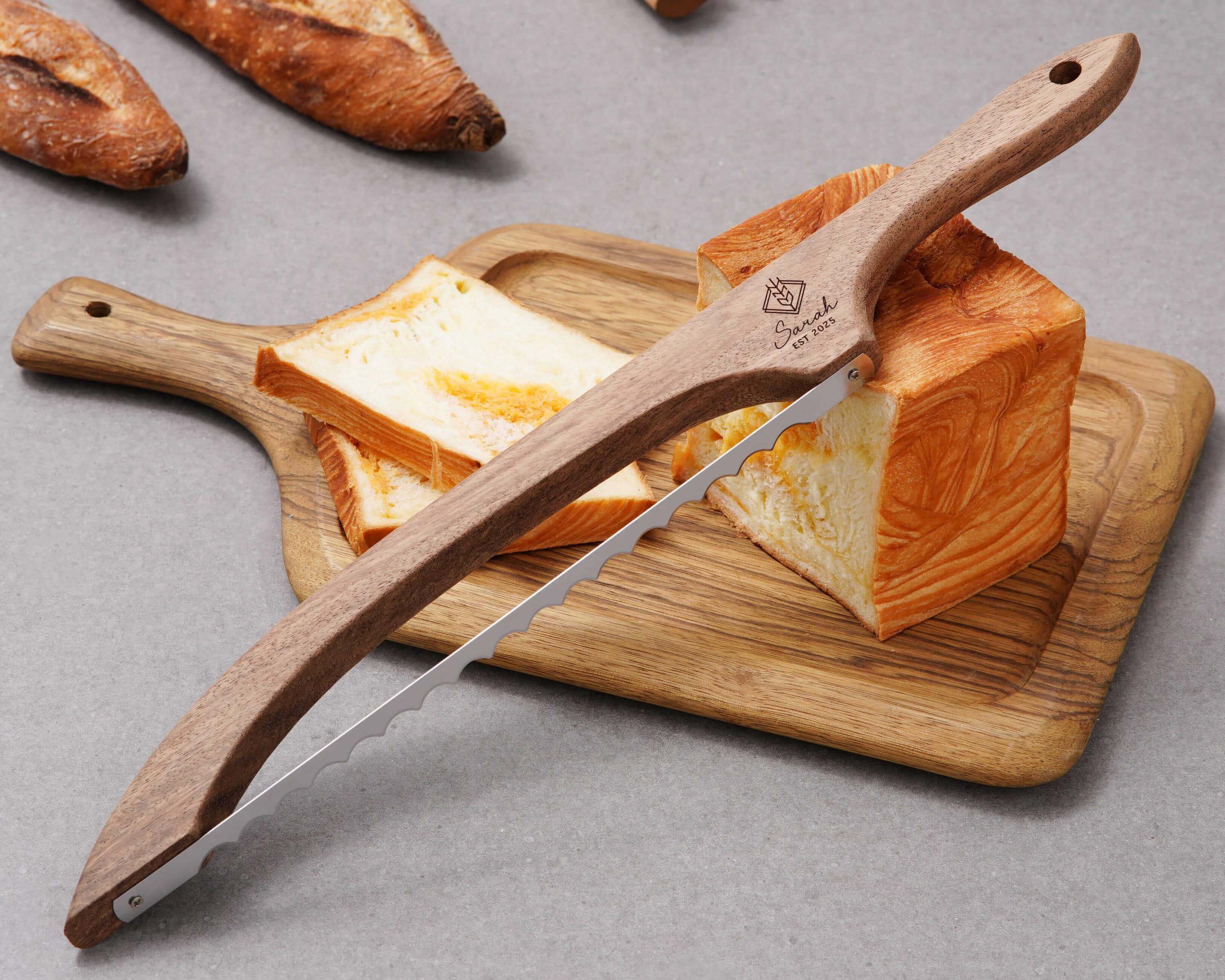 a wooden cutting board with a knife on top of it