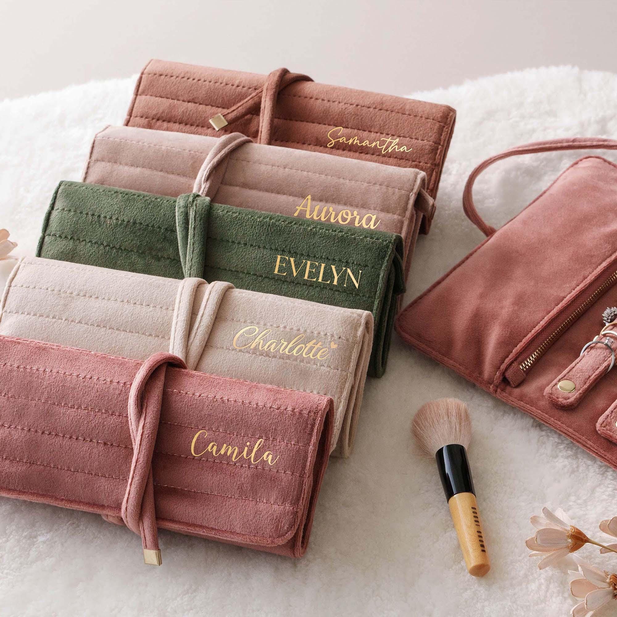 a set of five personalized makeup bags