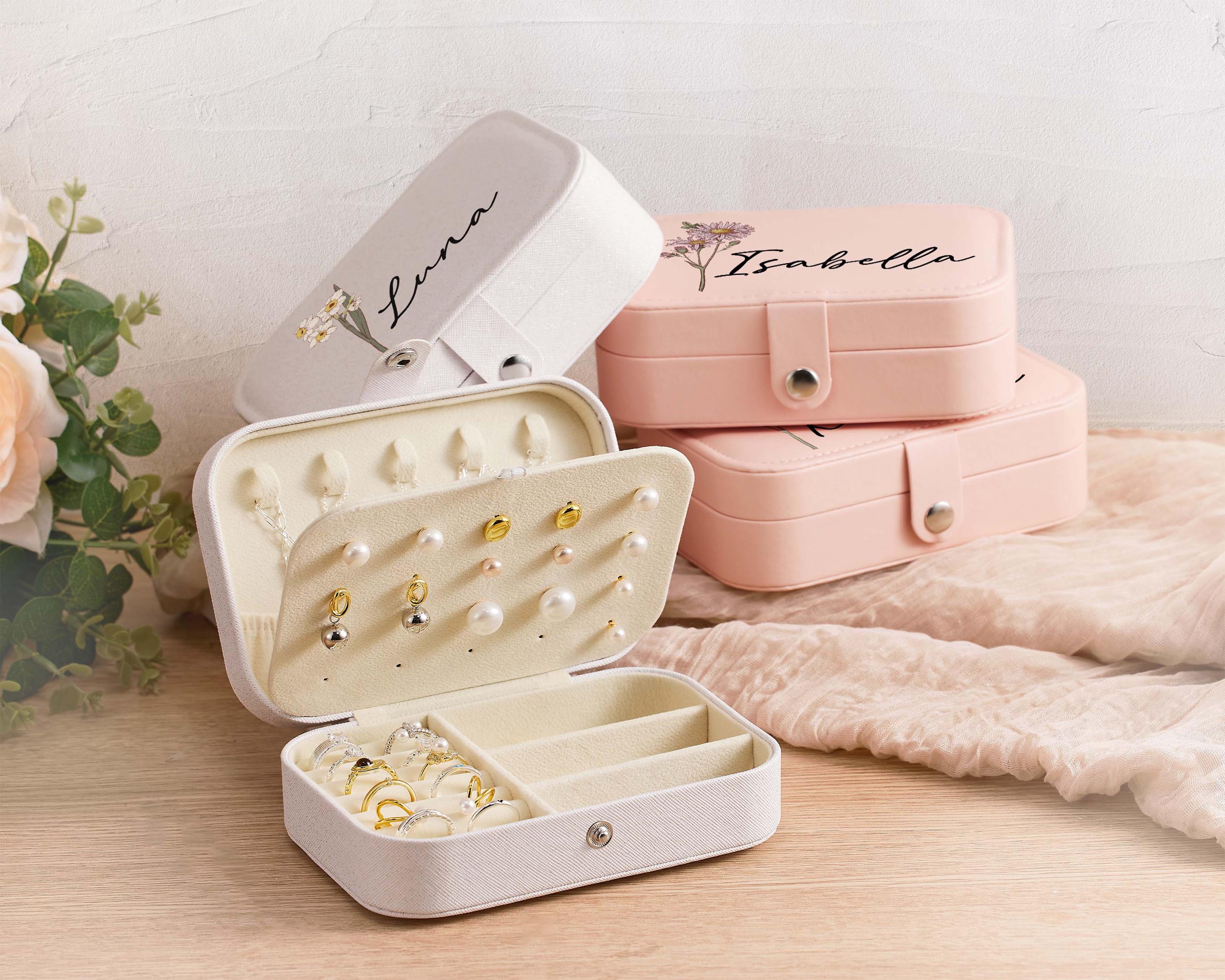 a pair of jewelry boxes sitting on top of a table