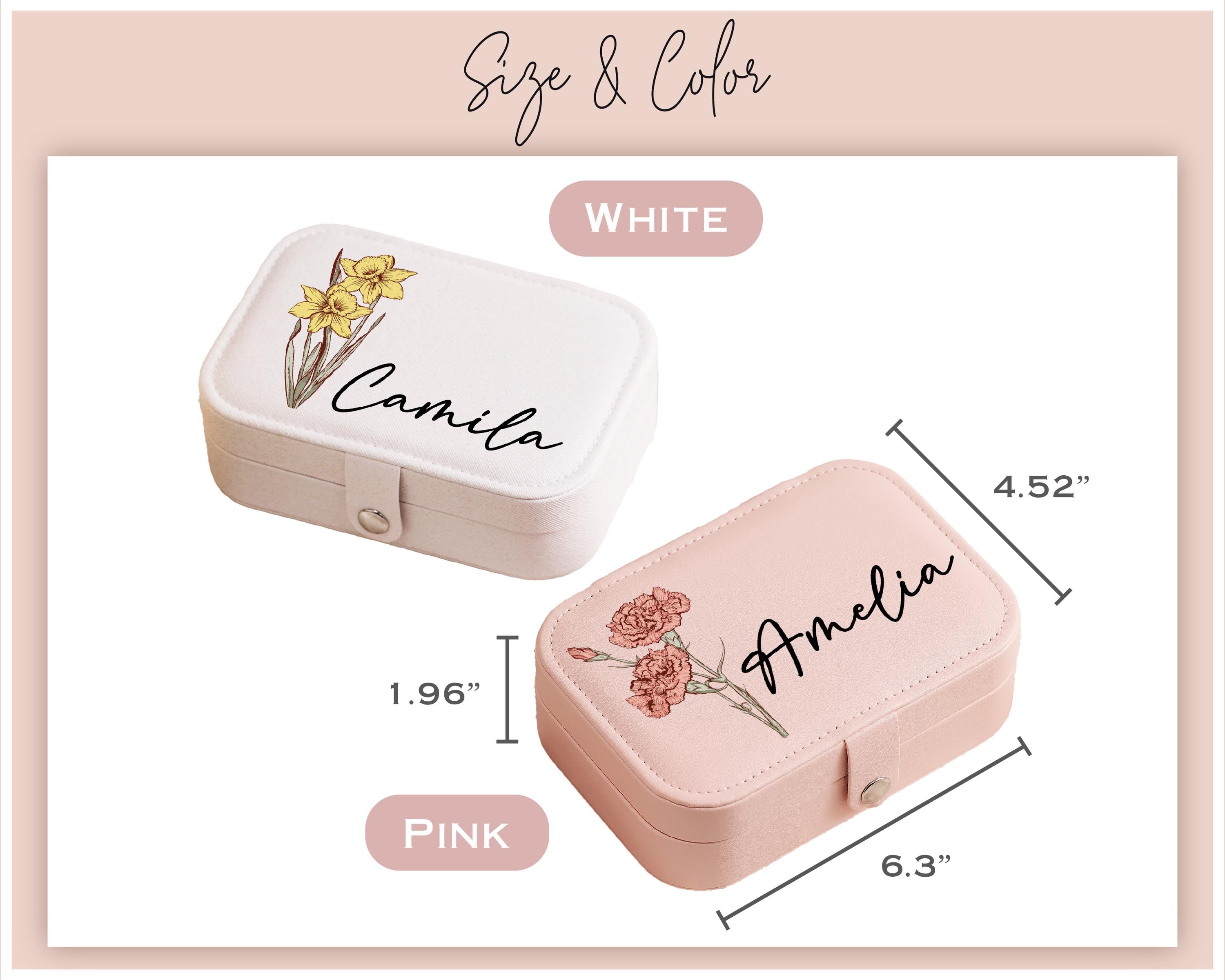 a pink and white box with a flower on it