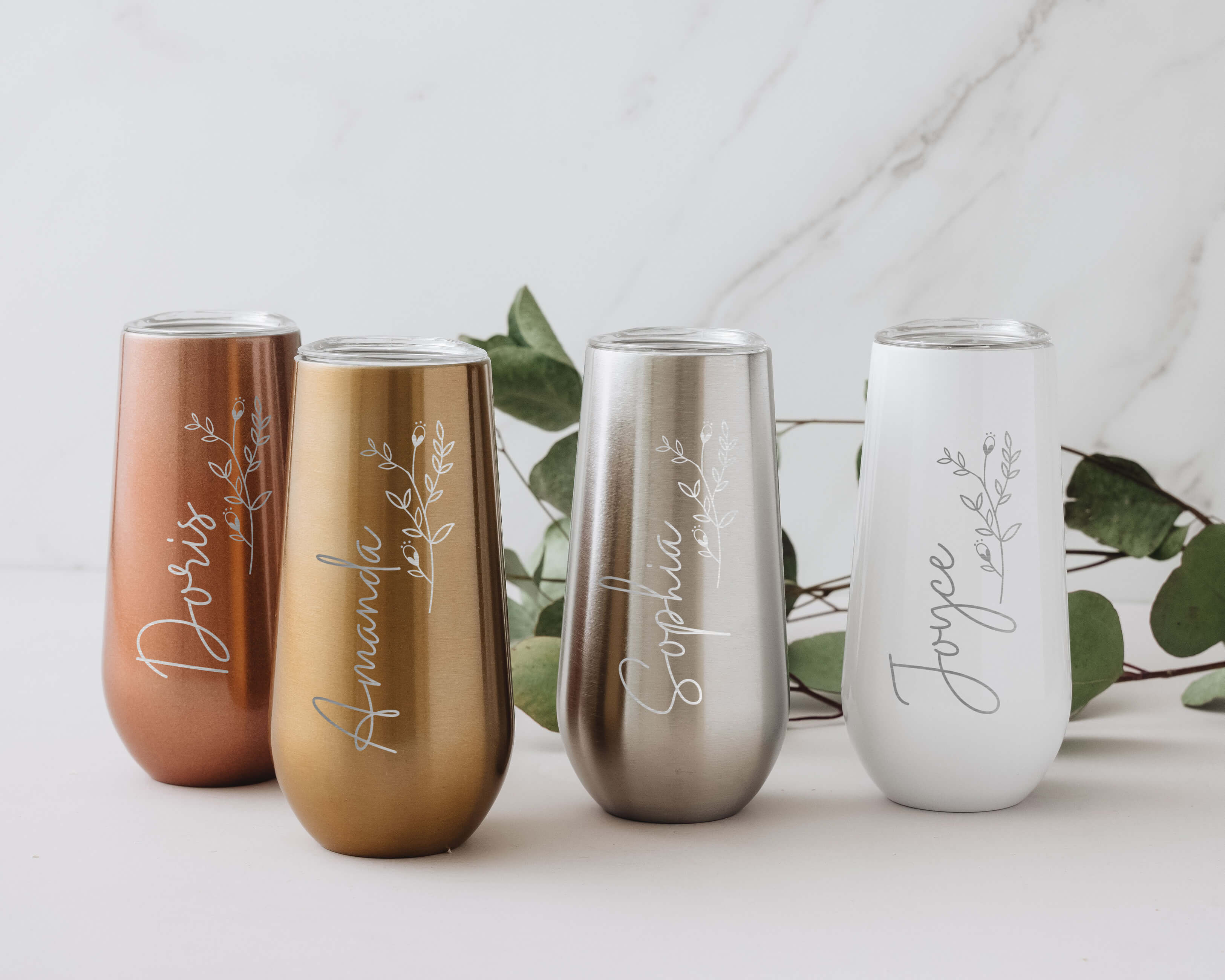 Custom white, rose gold, gold and silver champagne tumblers with custom birth month flower and name. Custom champagne tumbler is the perfect bridesmaid gifts for your besties.