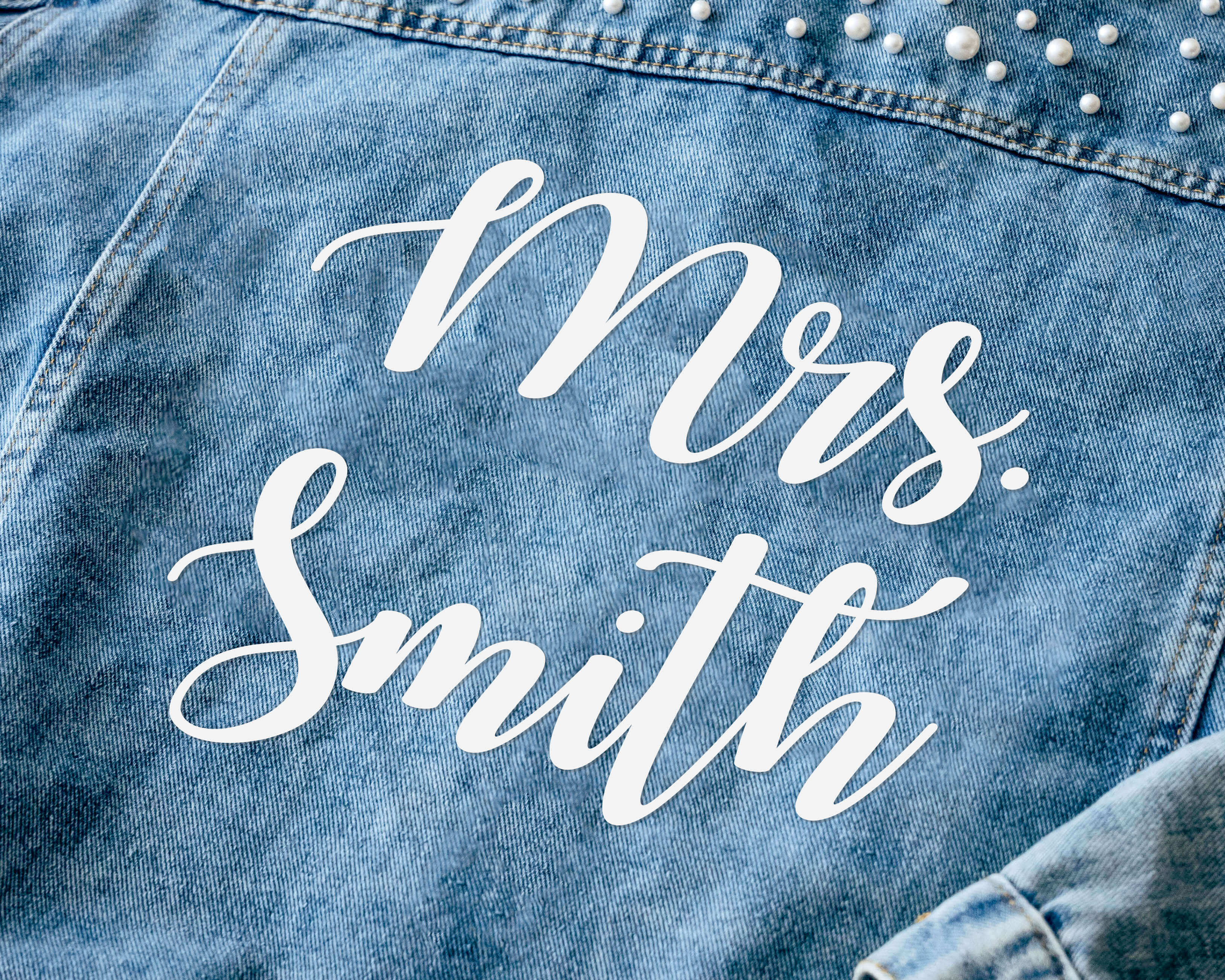 Make your wedding day even more special with our custom bride jean jacket featuring elegant text design.