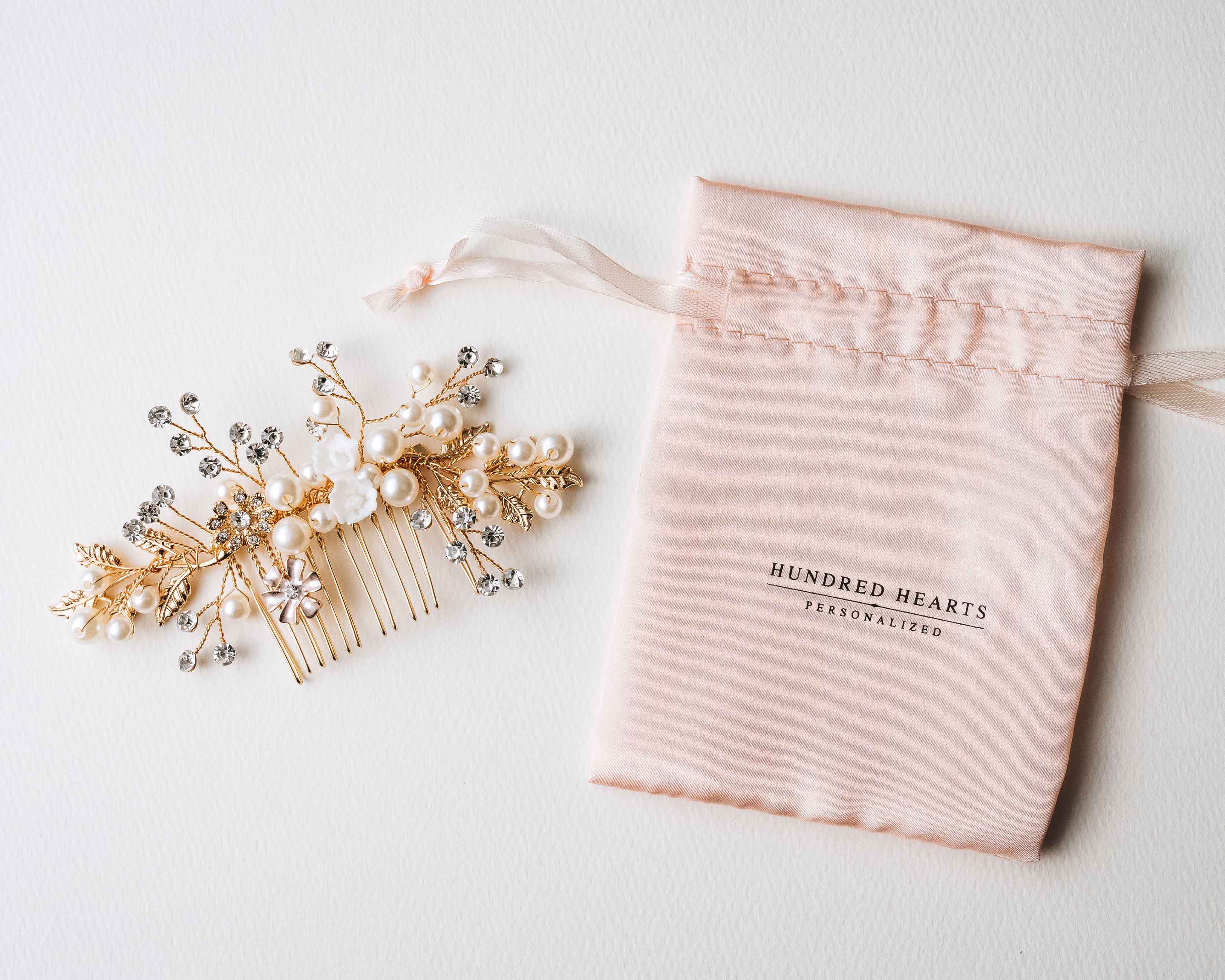 A close-up view of the Bridal Hair Comb, highlighting its intricate pearl and crystal details.