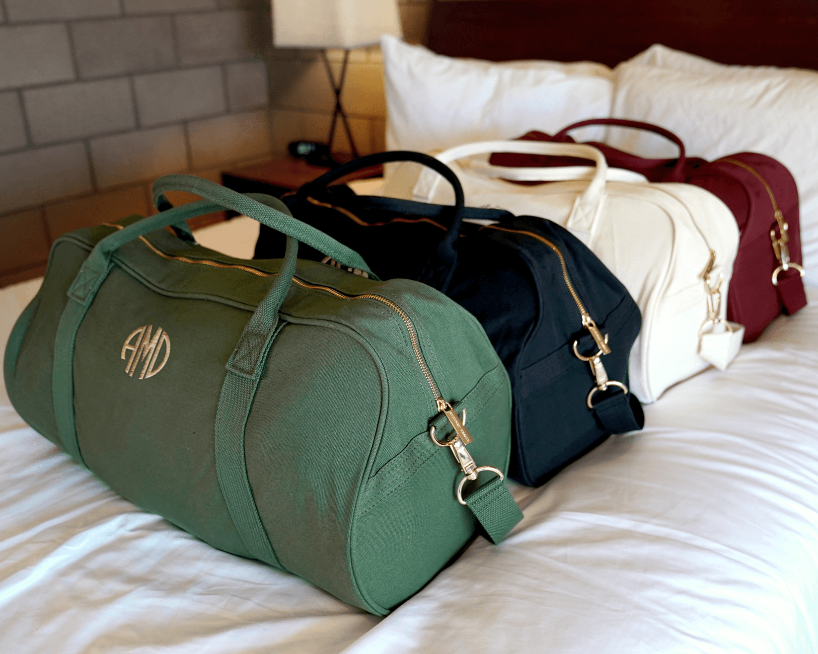 Personalized white, olive green, navy and mulberry Duffle Bags with initials.